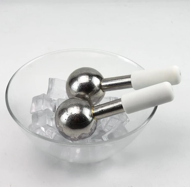 ZAQ Icy Steel Cryo Ice Globes in bowl of ice  headaches skincare massage redness calm waxing extractions laser facial muscles puffy eyes dark circles depuff depuffing lymphatic massage health beauty wellness hudson valley